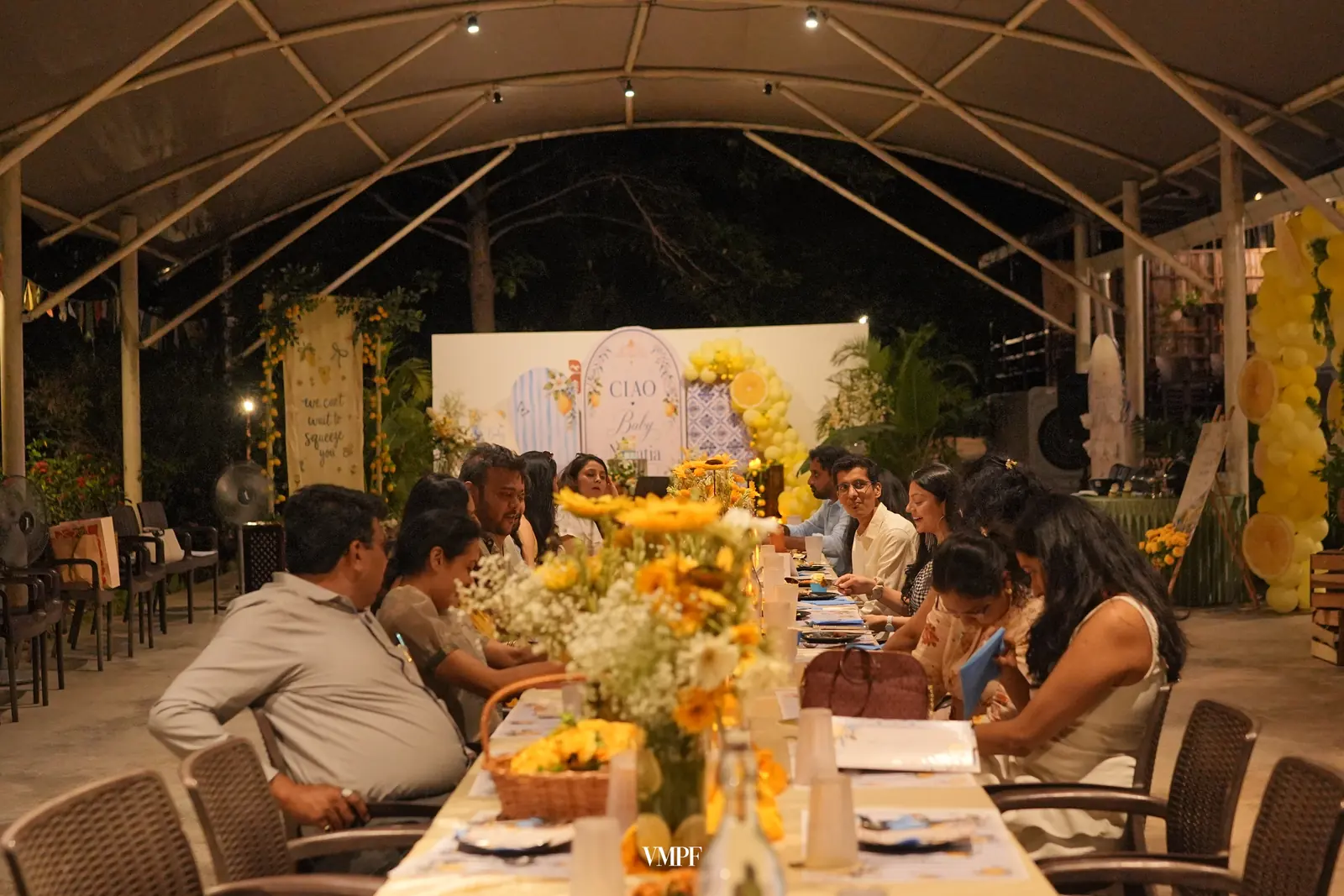 Guests at dinner under the covered pavilion