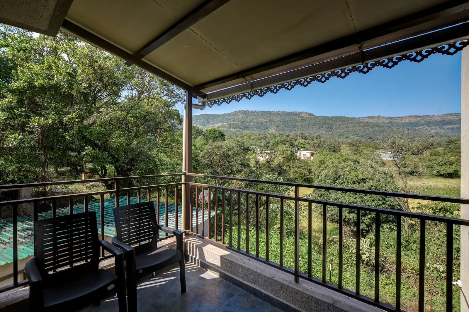 Villa balcony over the pool and hills