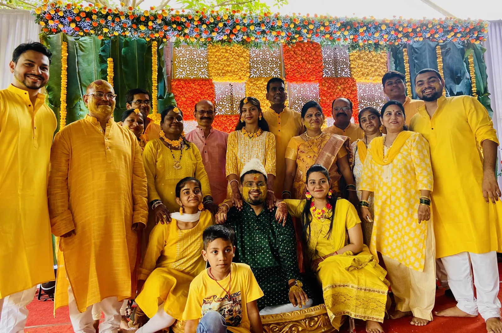 Family in yellow at a haldi