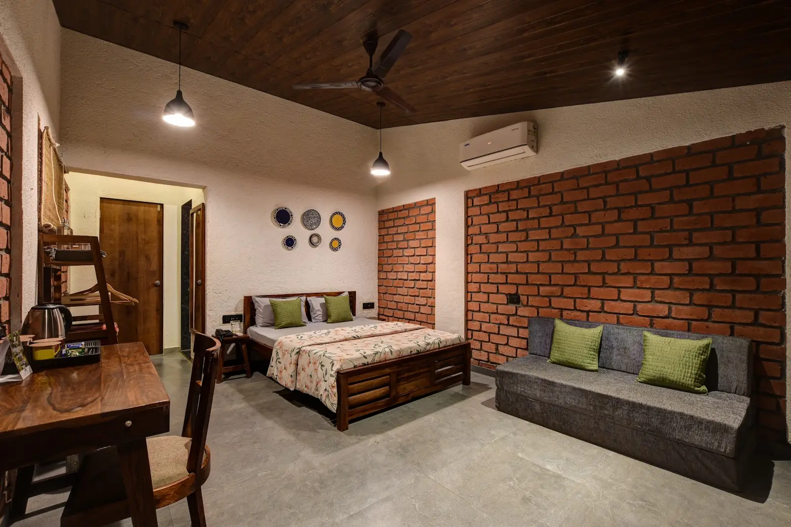 Nest Cottage bedroom with a brick wall