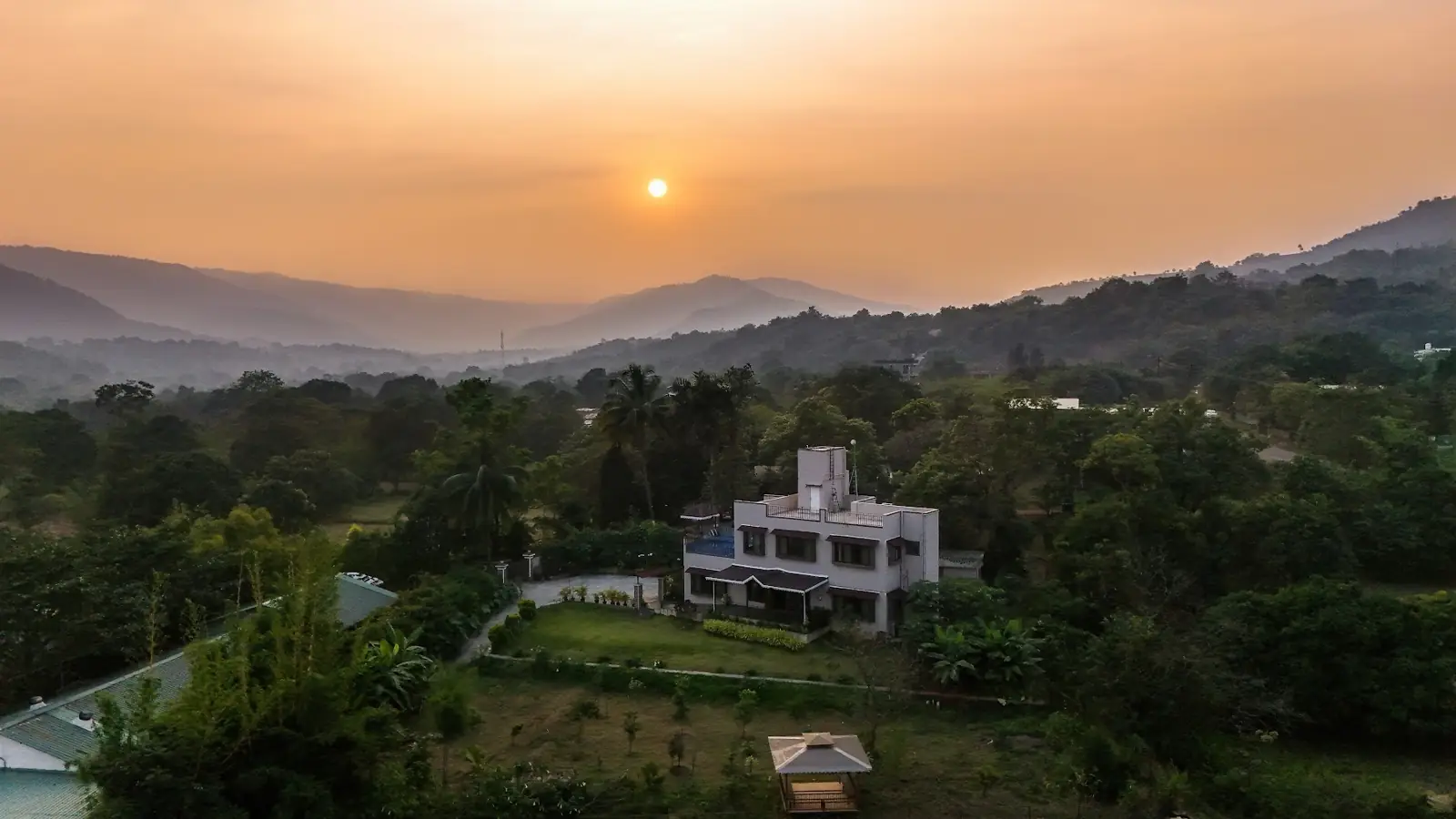 Sun setting over the hills behind the villa